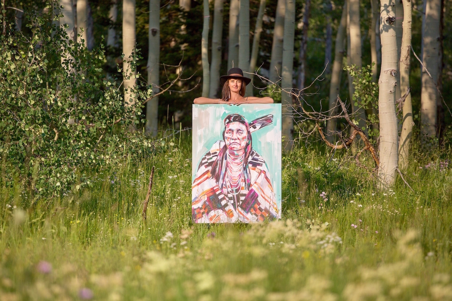 Dunn with Chief Joseph painting. Chief Joseph is known for valiantly resisting the removal of his people from their sacred land in Wallowa Valley (now northeastern Oregon) – Resistance Series. Credit: Mars Ramp