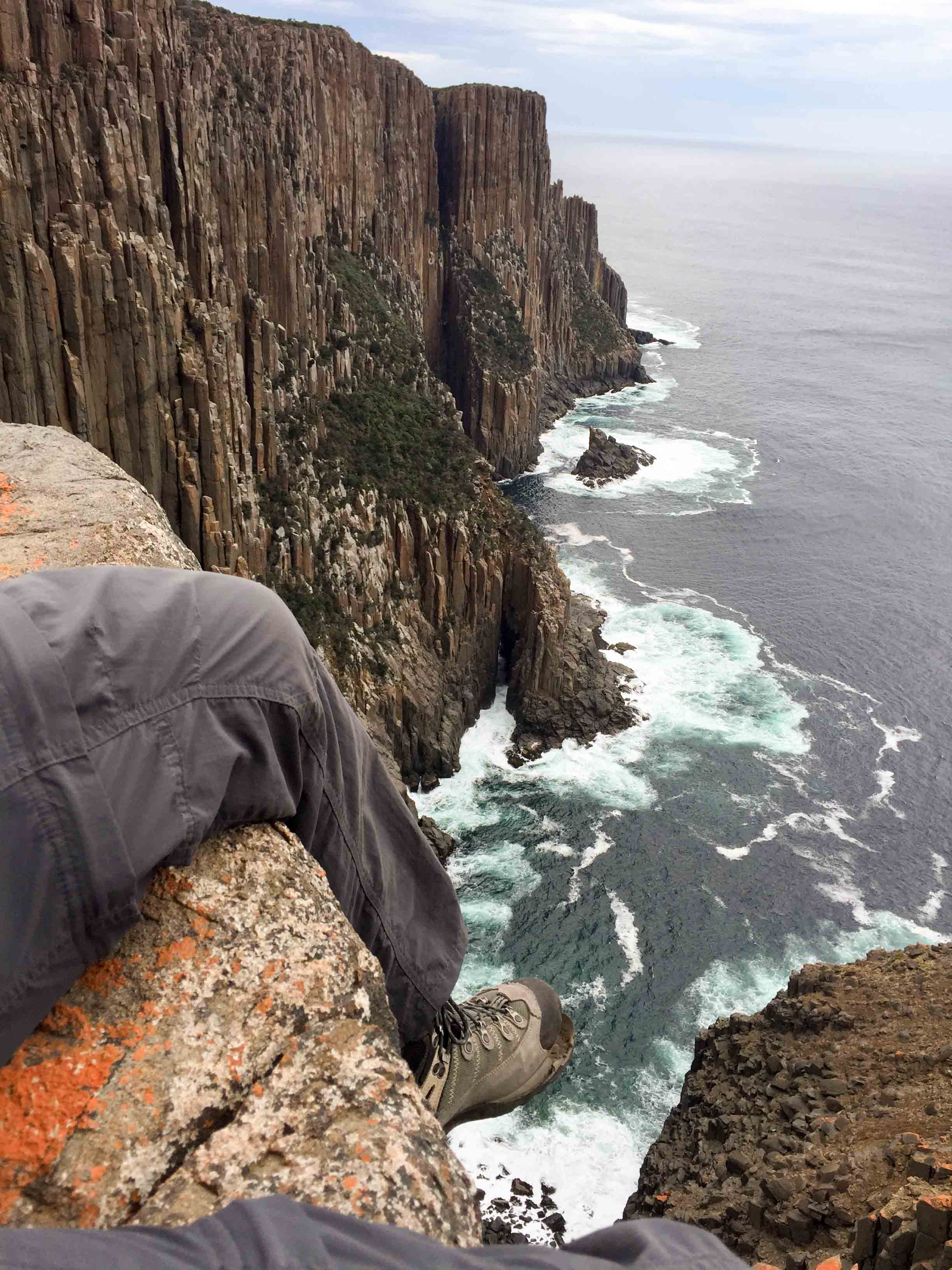Hanging off a cliff in Tasmania